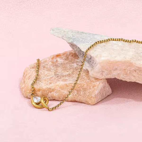 Gold Abstract Ribbon Necklace with Pear-Cut Stone