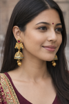 Traditional Gold Finish Jhumka Earrings with Red & Green Stones